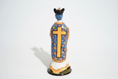 A large Dutch Delft polychrome figure of a standing priest, 18th C.