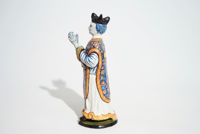 A large Dutch Delft polychrome figure of a standing priest, 18th C.