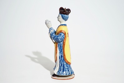 A large Dutch Delft polychrome figure of a standing priest, 18th C.