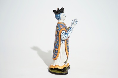 A large Dutch Delft polychrome figure of a standing priest, 18th C.