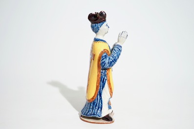 A large Dutch Delft polychrome figure of a standing priest, 18th C.