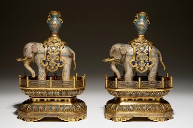 A pair of Chinese gilt bronze and cloisonne elephants on stands, 19th C.