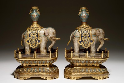 A pair of Chinese gilt bronze and cloisonne elephants on stands, 19th C.