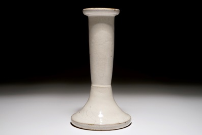A white Dutch Delft candle stick and a holy water font, 18th C.