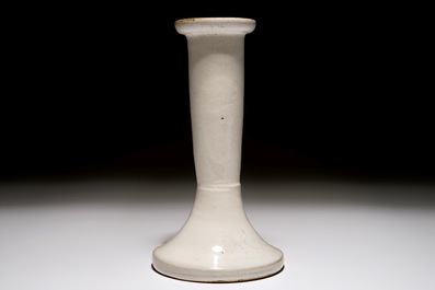 A white Dutch Delft candle stick and a holy water font, 18th C.