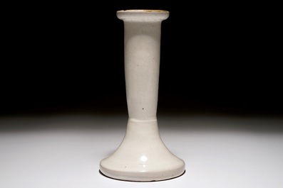 A white Dutch Delft candle stick and a holy water font, 18th C.