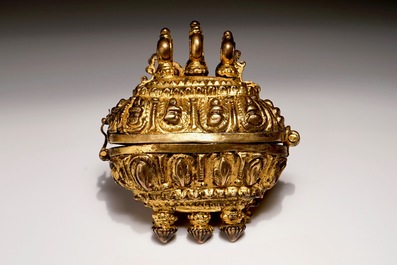 A gilt bronze amulet box with coloured glass inlay, India, 18th C.