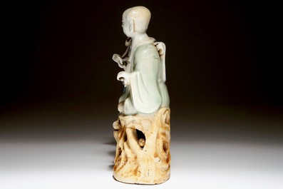 A Chinese celadon and blue-white glazed group of the Hehe Er Xian twins, Qianlong
