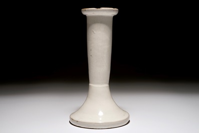 A white Dutch Delft candle stick and a holy water font, 18th C.