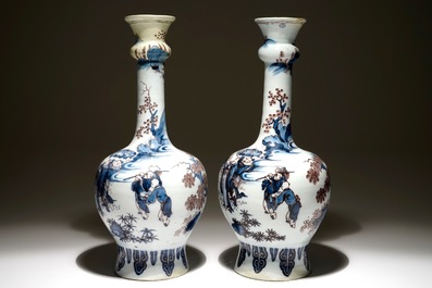 A pair of large Dutch Delft blue, white and manganese chinoiserie garlick neck vases, 17th C.