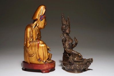 A Chinese bronze figure of Green Tara and a gilt wooden Guanyin, 19th C.