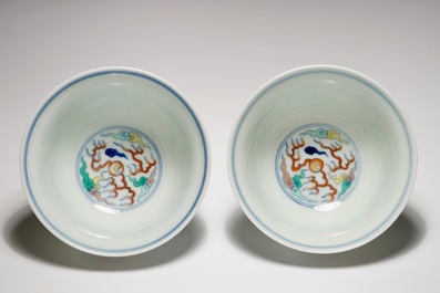 A pair of Chinese doucai &quot;dragon&quot; bowls, Yongzheng mark, 20th C.