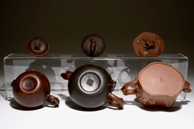 A set of three Chinese Yixing teapots, 20th C.