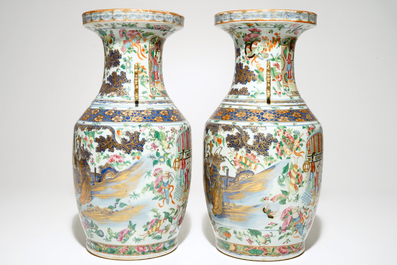 A pair of Chinese Canton famille rose and gilt vases, 19th C.