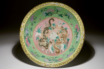 A large Chinese water jug and basin with black dragons on a lime green ground, 19th C.