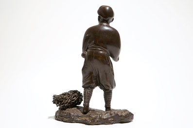 A Japanse bronze figure of a man with a double gourd, Meiji