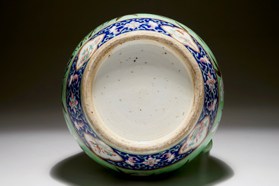 A large Chinese water jug and basin with black dragons on a lime green ground, 19th C.