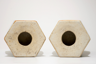 A pair of Chinese hexagonal blue and white on celadon ground vases with buddhist lions, 19th C.