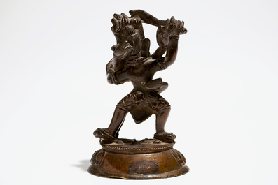 A Sino-Tibetan bronze figure of Mahakala with Sakti, 19th C.