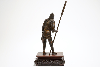 A Japanese bronze figure of a fisherman, signed Miyao, on a wooden stand