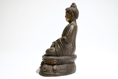 A Chinese bronze model of a seated Buddha Shakyamuni, Ming