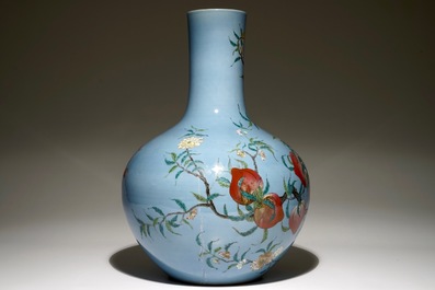 A Chinese famille rose blue ground tianqiuping &ldquo;Nine peaches&rdquo; vase, 19/20th C.
