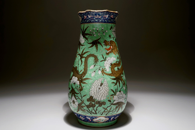 A large Chinese water jug and basin with black dragons on a lime green ground, 19th C.