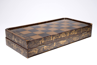 A fine Chinese lacquer chess and backgammon board with ivory game pieces, 19th C.