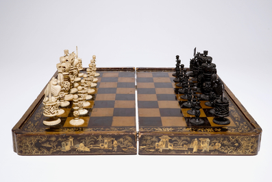 A fine Chinese lacquer chess and backgammon board with ivory game pieces, 19th C.