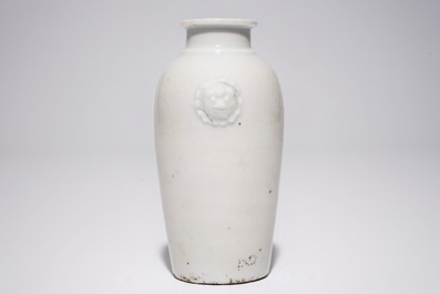 A Chinese blanc de Chine vase with lion's head-shaped handles, Kangxi