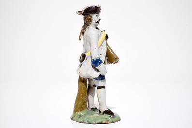 A polychrome pottery figure of a soldier, Brussels or France, 18th C.