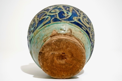 A turquoise and blue glazed calligraphy vase, Kashan, Iran, 12/13th C.