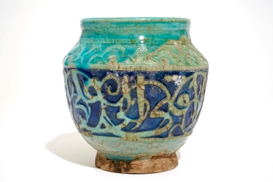 A turquoise and blue glazed calligraphy vase, Kashan, Iran, 12/13th C.