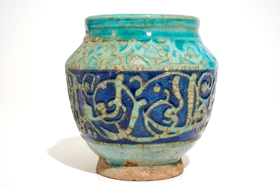 A turquoise and blue glazed calligraphy vase, Kashan, Iran, 12/13th C.