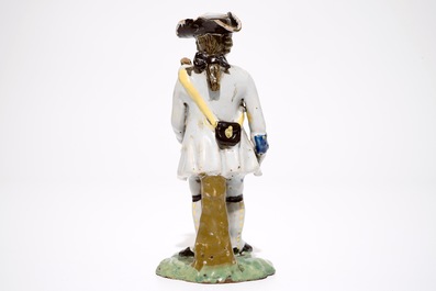 A polychrome pottery figure of a soldier, Brussels or France, 18th C.