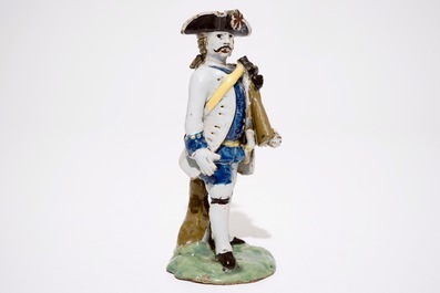 A polychrome pottery figure of a soldier, Brussels or France, 18th C.