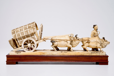 A Chinese carved ivory group of a farmer with buffaloes and a chariot, early 20th C.