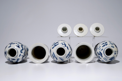 A five-piece Chinese blue and white garniture with dragons, 19th C.