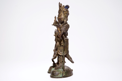Une grande figure en bronze dor&eacute;, traces de polychrome, Ming