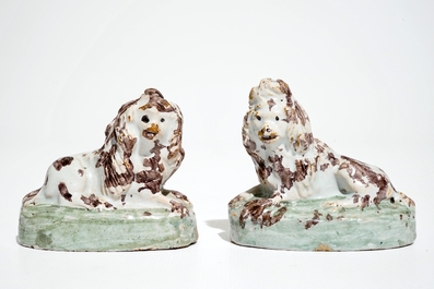 A pair of polychrome Brussels faience models of dogs, 18th C.