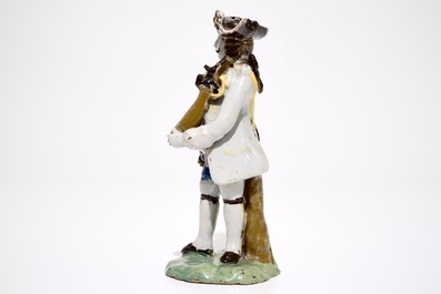A polychrome pottery figure of a soldier, Brussels or France, 18th C.
