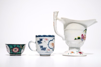A Chinese famille rose jug, a cup and saucer and another cup with ear, 18th C.