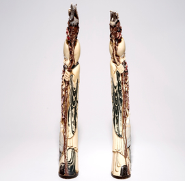A pair of tall polychrome Chinese carved ivory figures of immortals, 19th C.