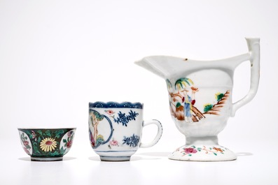 A Chinese famille rose jug, a cup and saucer and another cup with ear, 18th C.