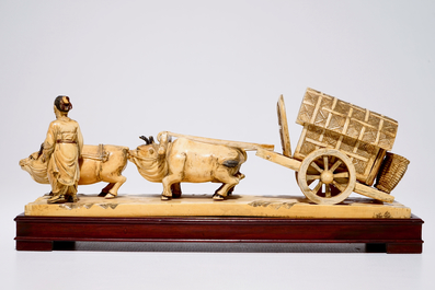 A Chinese carved ivory group of a farmer with buffaloes and a chariot, early 20th C.