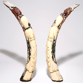 A pair of tall polychrome Chinese carved ivory figures of immortals, 19th C.