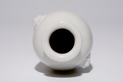 A Chinese blanc de Chine vase with lion's head-shaped handles, Kangxi