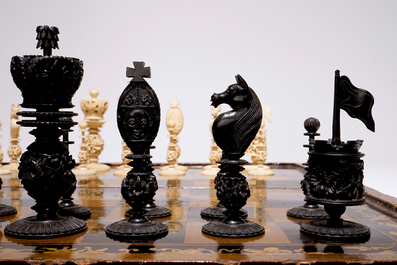 A fine Chinese lacquer chess and backgammon board with ivory game pieces, 19th C.