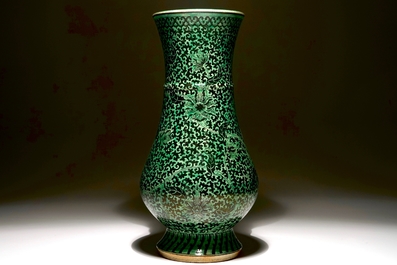 A rare Chinese verte-noire biscuit lotus scroll vase, Kangxi