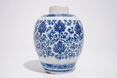 A Dutch Delft blue and white jar with peony scrolls in Ming-style, late 17th C.